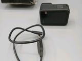 a black charger and a black box on a table