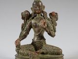 an image of a statue of a woman sitting on a lotus