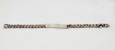 a close up of a silver chain bracelet on a white background
