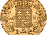 a close up of a gold coin with a crown on it