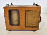 an old fashioned radio with a wooden case on a white surface