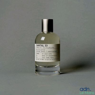 an image of a bottle of perfume sitting on a table