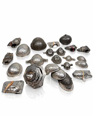 a lot of silver objects that are on a white surface