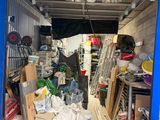 a garage with a lot of items inside of it