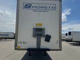 the back of a white box truck parked in a parking lot