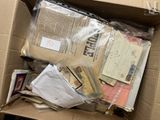 a cardboard box filled with many different types of mail