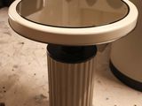 a small table with a mirror on top of it