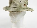 an image of a white mannequin head with a hat on it