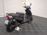 a scooter that is parked in a room
