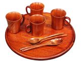 a wooden tray with cups and spoons on it