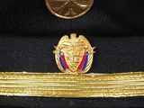 a close up of a military hat with a medal on it