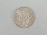 an image of a coin on a white surface