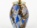 an image of a blue vase with a gold lid