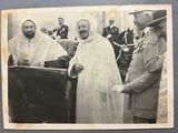 black and white photograph of a man in a white robe and a woman in a white dress and a man in a white robe and a man in a black and