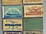 several different types of matchboxes are displayed on a table