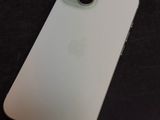 an apple iphone sitting on top of a black table next to a cell phone