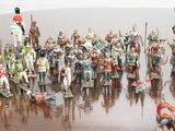 a lot of figurines that are sitting on a table