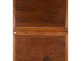 an old wooden chest with two drawers on top of it