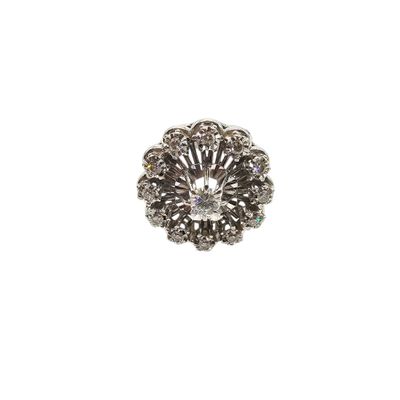 a close up of a diamond ring on a white background