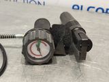 a close up of a pressure gauge on a table