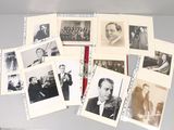 several black and white photographs of men in suits and ties on a table