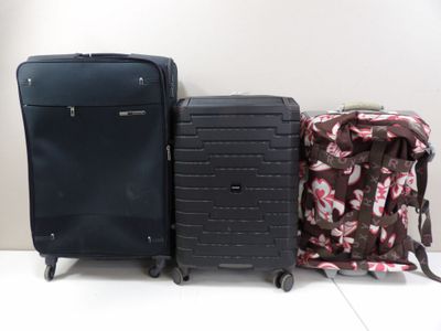 two pieces of luggage sitting next to each other on the floor