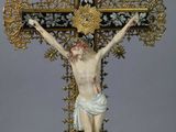 statue of a crucifix with a cross on a pedestal