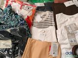 a pile of clothing that is sitting on the floor