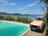 a car that is parked next to a swimming pool
