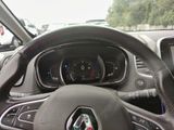 a steering wheel and dashboard of a car on the street