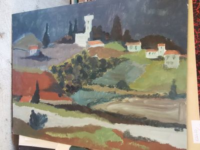 une photo d'un tableau posé sur un chevalet, lui-même posé sur une table