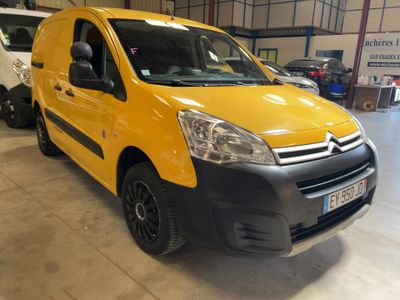 a yellow van parked in a garage with other vehicles