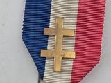 an image of a medal with a cross and a star on it
