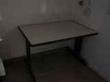a small table in the corner of a small room