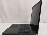 the laptop is open on a white surface with a white background