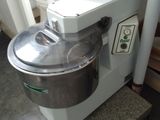 a mixer that is sitting on a counter in a room