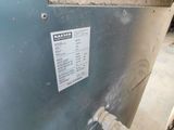 an image of a close up of a gas furnace with a hose