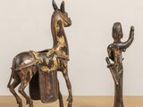 pair of antique wooden figurines of a horse and a woman