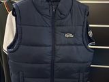 the vest is hanging on a rack in the store