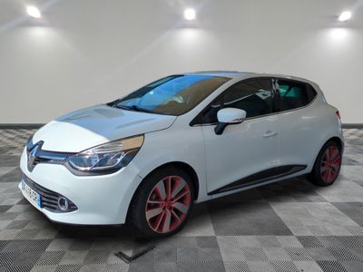 the white car is parked on a checkered floor in the garage