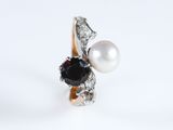 an image of a ring with a pearl and a black diamond