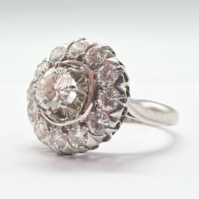 an image of a diamond cluster ring on a white background