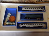 a box with a train set in it on a table