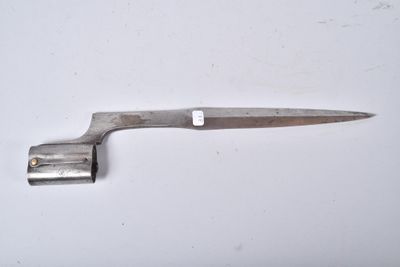 a knife that is laying on a white surface