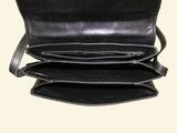 a black purse that is open on a white background
