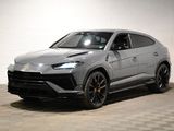 the lamb suv is parked in a garage with a checkered floor