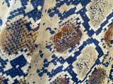 a close up of a blue and white patterned cloth with a pattern