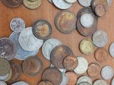a lot of coins that are on the table
