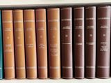 many books that are on a shelf in a book case