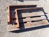 a pile of wooden pallets sitting on the ground